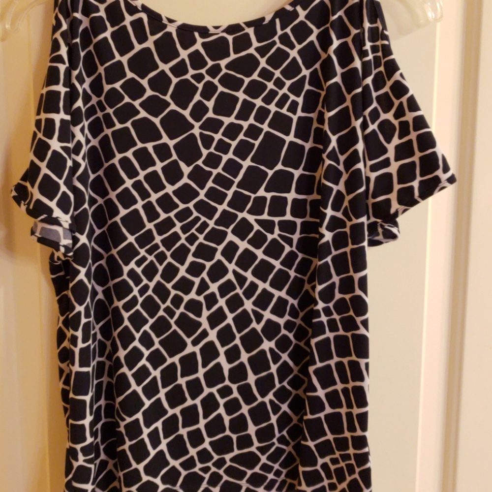 Gently worn Michael Kors top, sleeve has a slit in